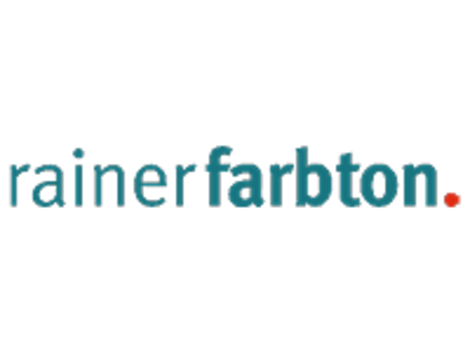 Textlogo: "rainerfarbton" in türkis mit rotem Punkt am Ende.